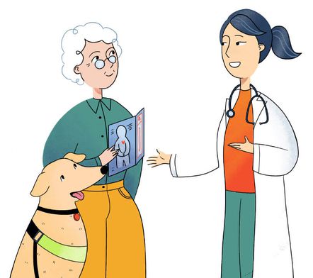 A woman doctor talking to a woman and her dog. The woman is holding a medical leaflet. 